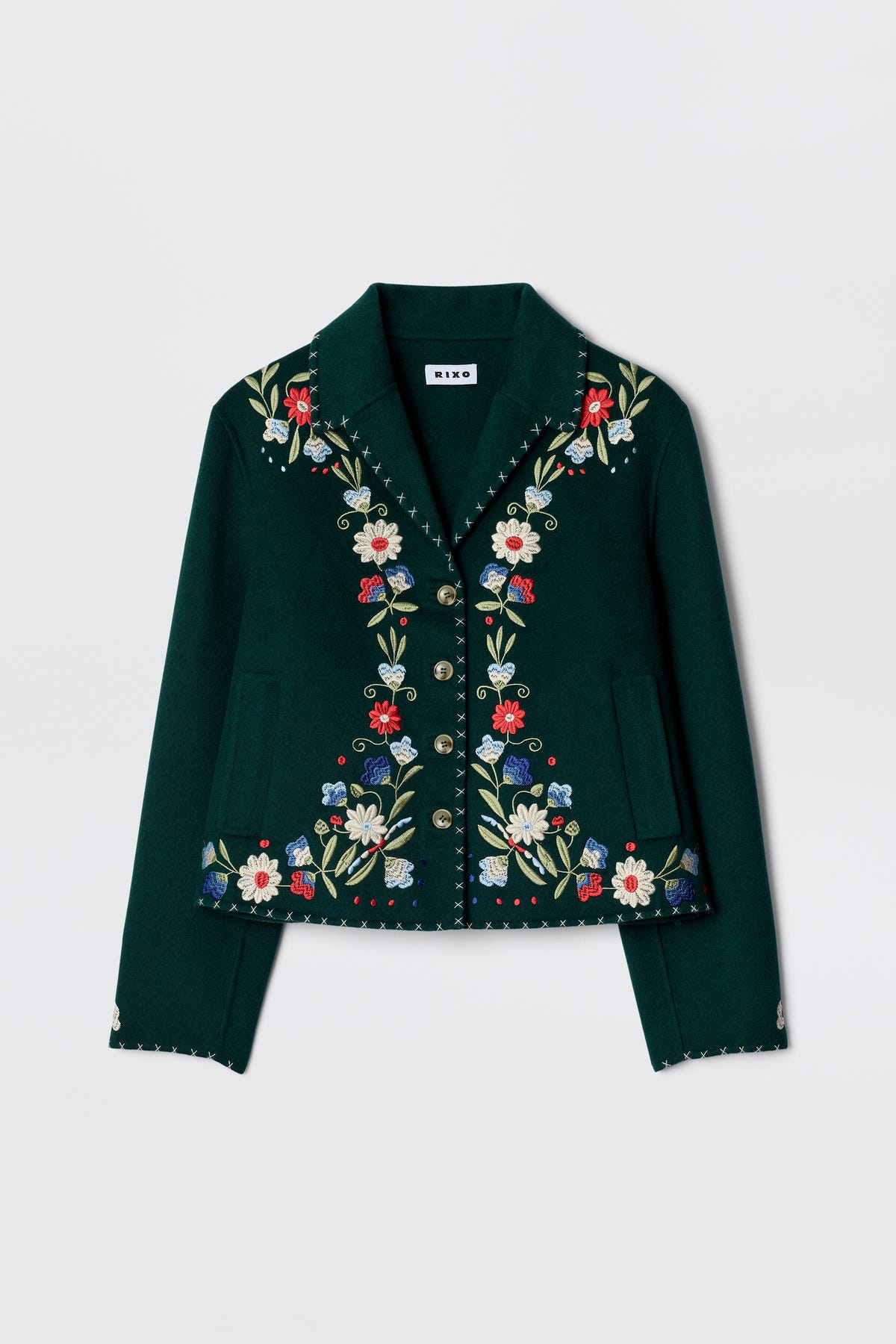 The Jude - Bliss Embroidery Green jacket by RIXO is a dark green, cropped piece with vibrant embroidery on the front, lapels, and cuffs, finished with decorative metallic buttons.