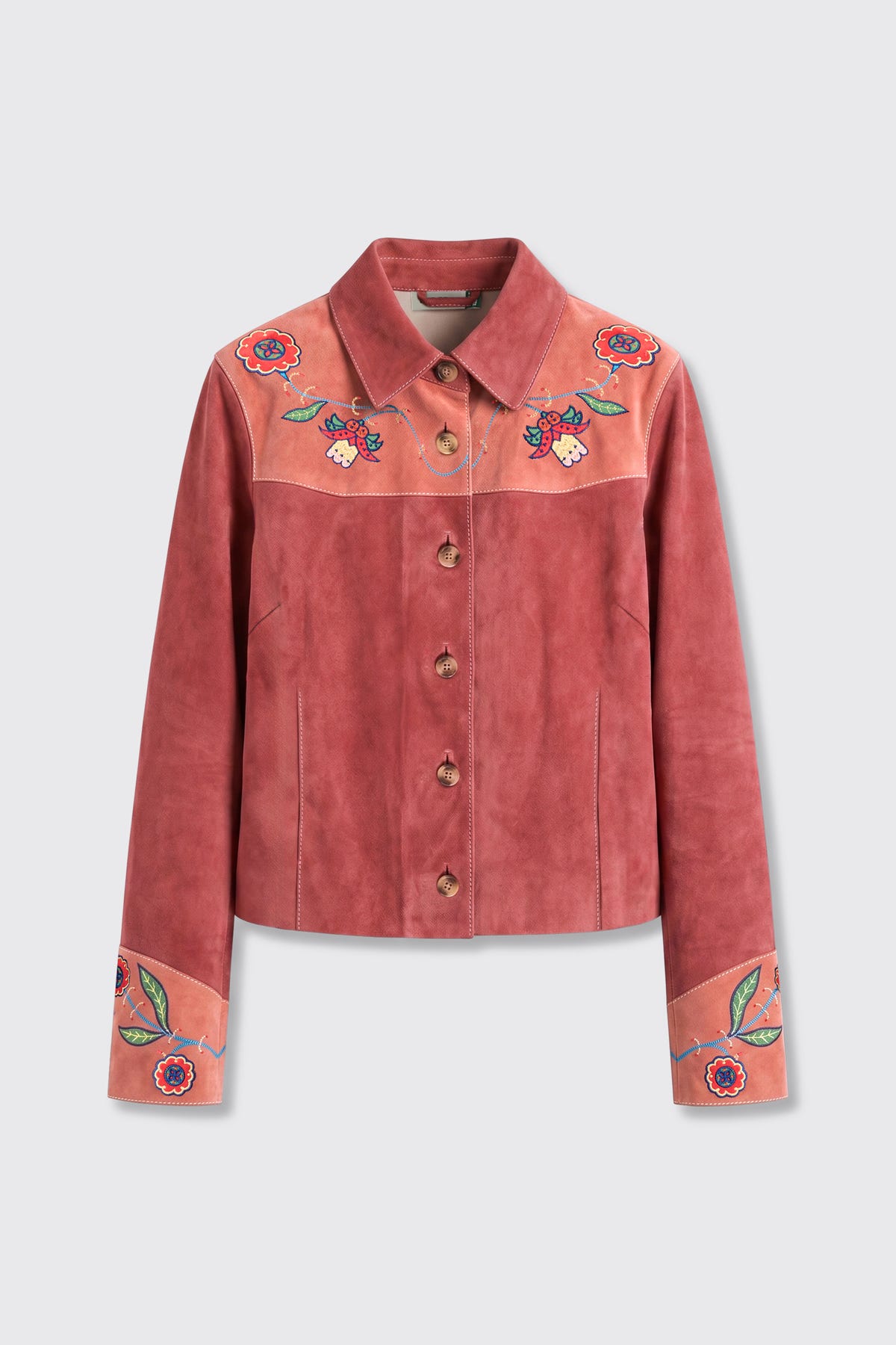 The Karmen - Folk Bloom Appliqué Brown jacket features brown suede with floral embroidery on the collar, shoulders, and cuffs. It has a button-up front and a tailored fit, displayed against a plain light background.
