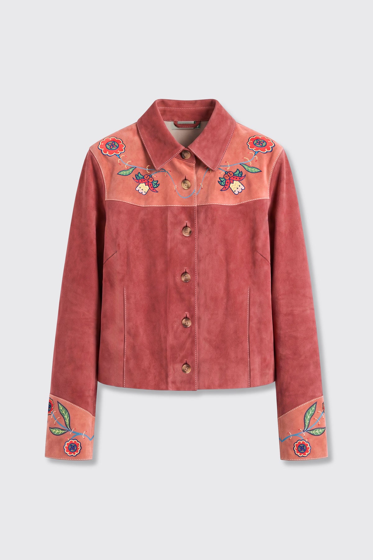 The Karmen - Folk Bloom Appliqué Brown jacket features brown suede with floral embroidery on the collar, shoulders, and cuffs. It has a button-up front and a tailored fit, displayed against a plain light background.