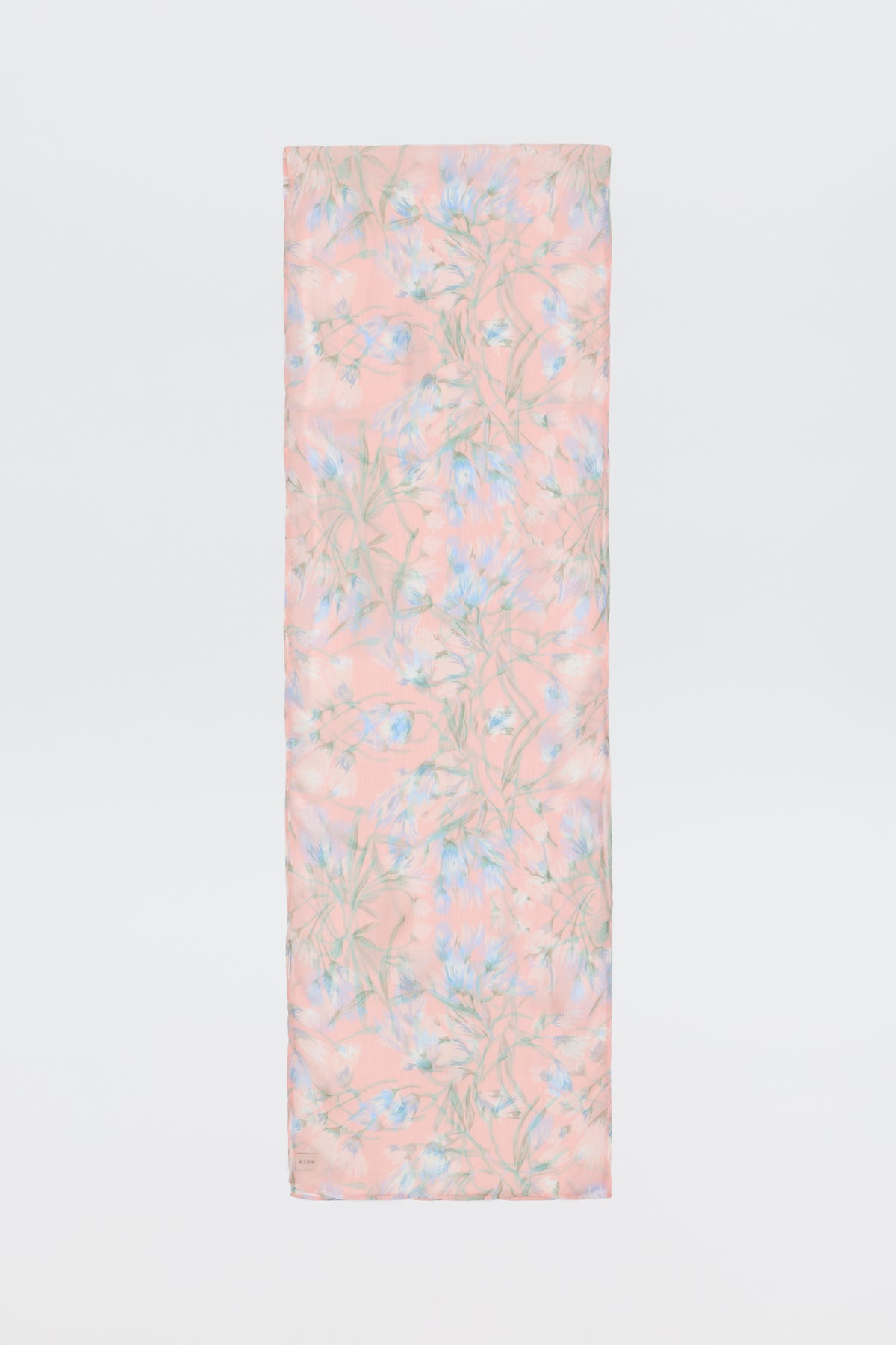 The Julien - Watercolour Floral Pink is a rectangular pink scarf with a soft floral pattern in light blue, green, and white, shown against a white background.