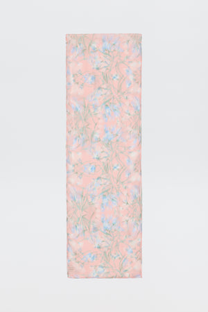 The Julien - Watercolour Floral Pink is a rectangular pink scarf with a soft floral pattern in light blue, green, and white, shown against a white background.
