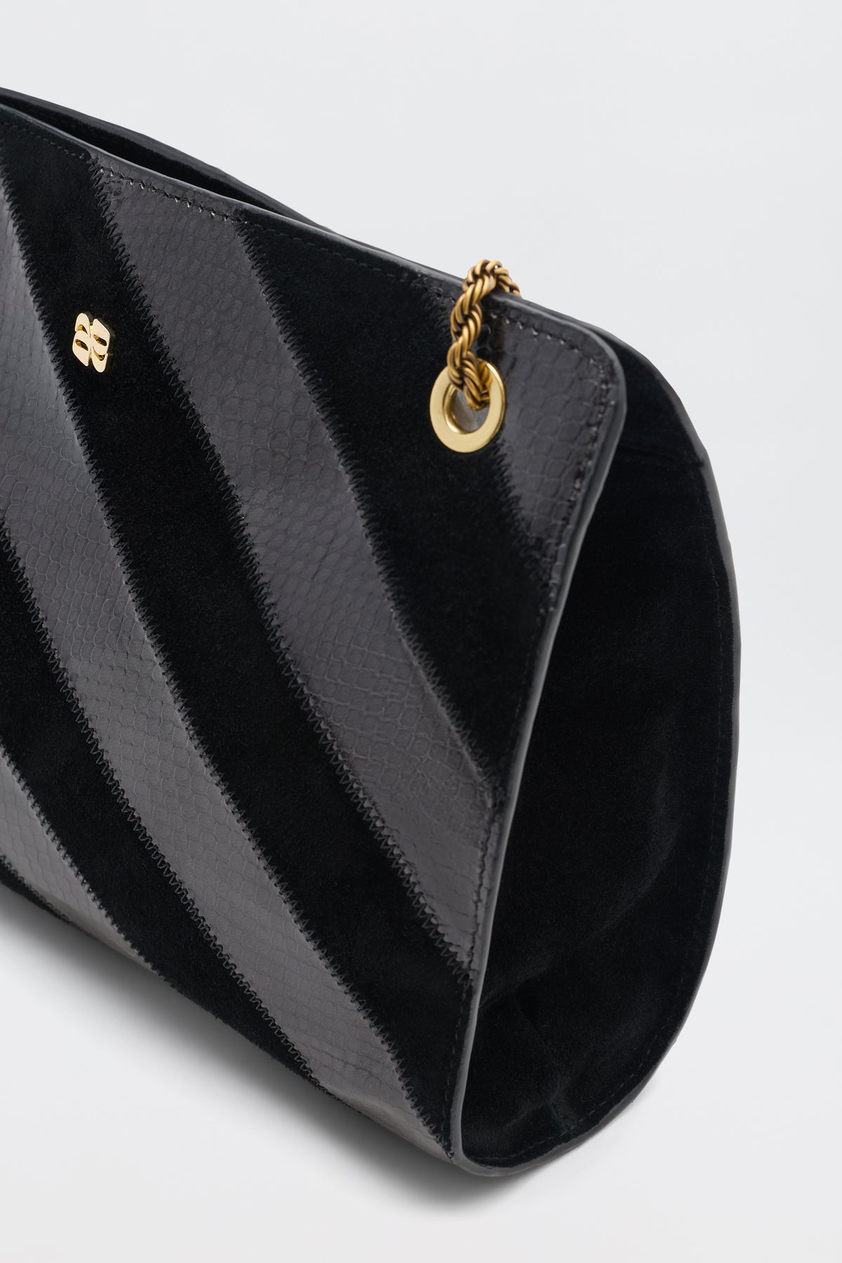 Eleina - Black handbag with a striped pattern, gold-tone hardware, and a braided chain strap.