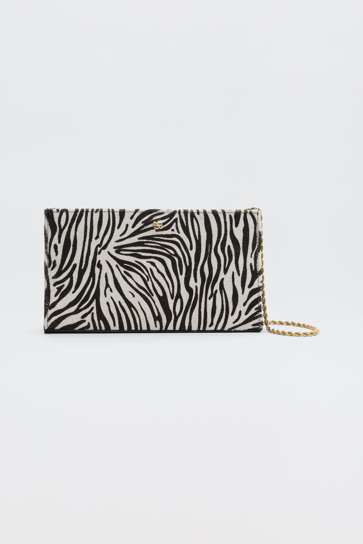 Kamila - Zebra Print Brown rectangular clutch bag with a brown and cream zebra print and a gold-tone chain strap.