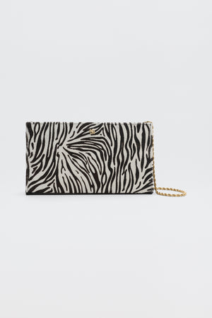 Kamila - Zebra Print Brown rectangular clutch bag with a brown and cream zebra print and a gold-tone chain strap.
