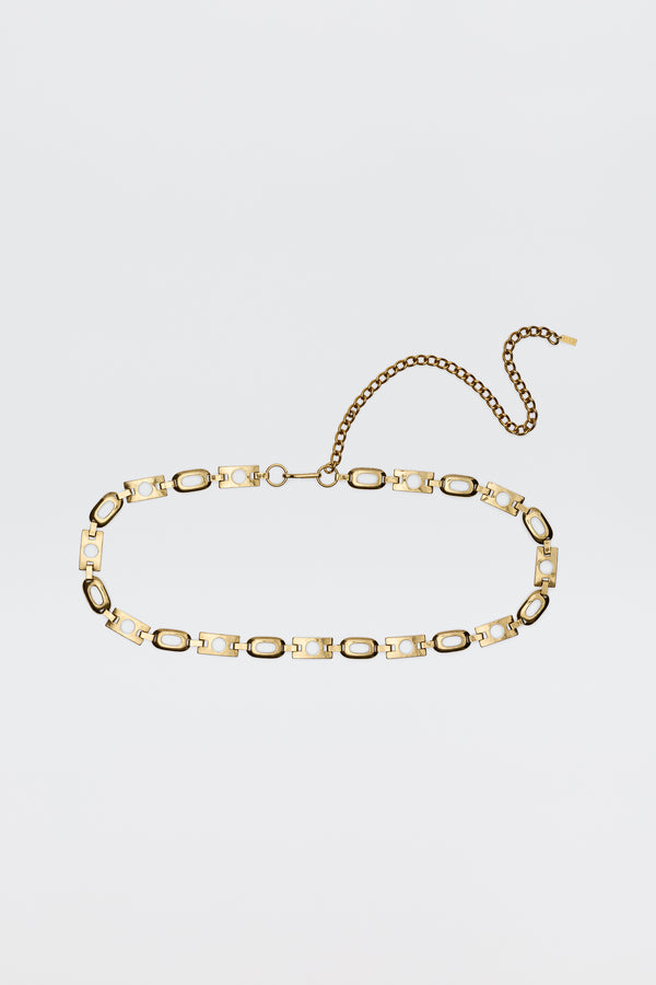 The Novie - Gold belt features alternating oval and rectangular gold-tone links, a lobster clasp, and an adjustable extension chain, displayed on a plain white background.