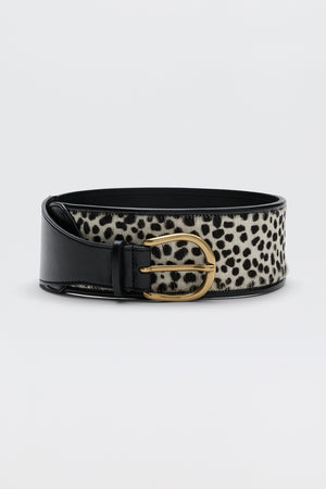 The Calista - Zandra Animal Brown belt features a wide design with a black leather edge, brown and black leopard print pattern, and a gold-tone buckle, shown against a plain light gray background.
