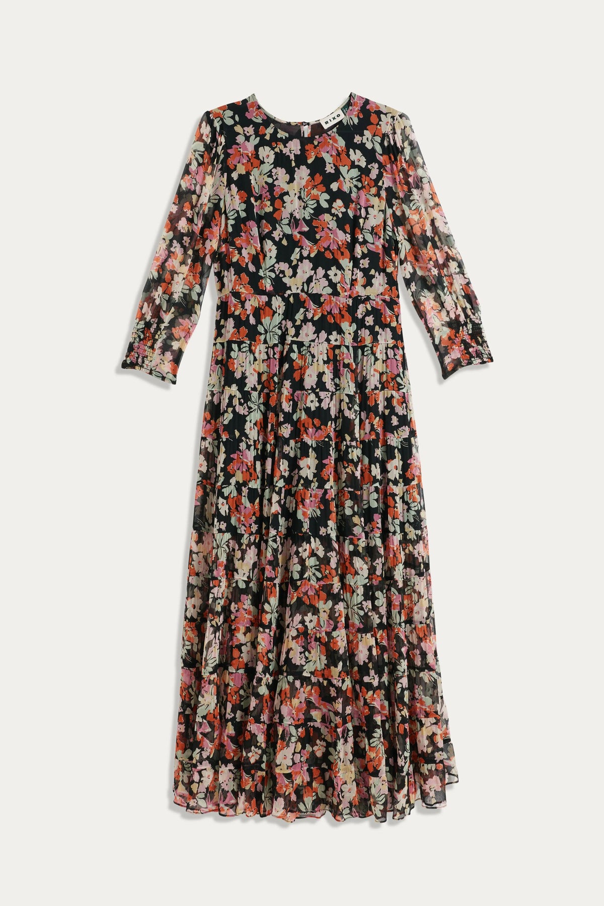 The Kristen - Primrose Floral Deep Navy is an ankle-length, long-sleeved dress with a black base and vintage floral prints in pink, red, orange, and white. Fitted at the waist with a pleated skirt—ideal with ankle boots.