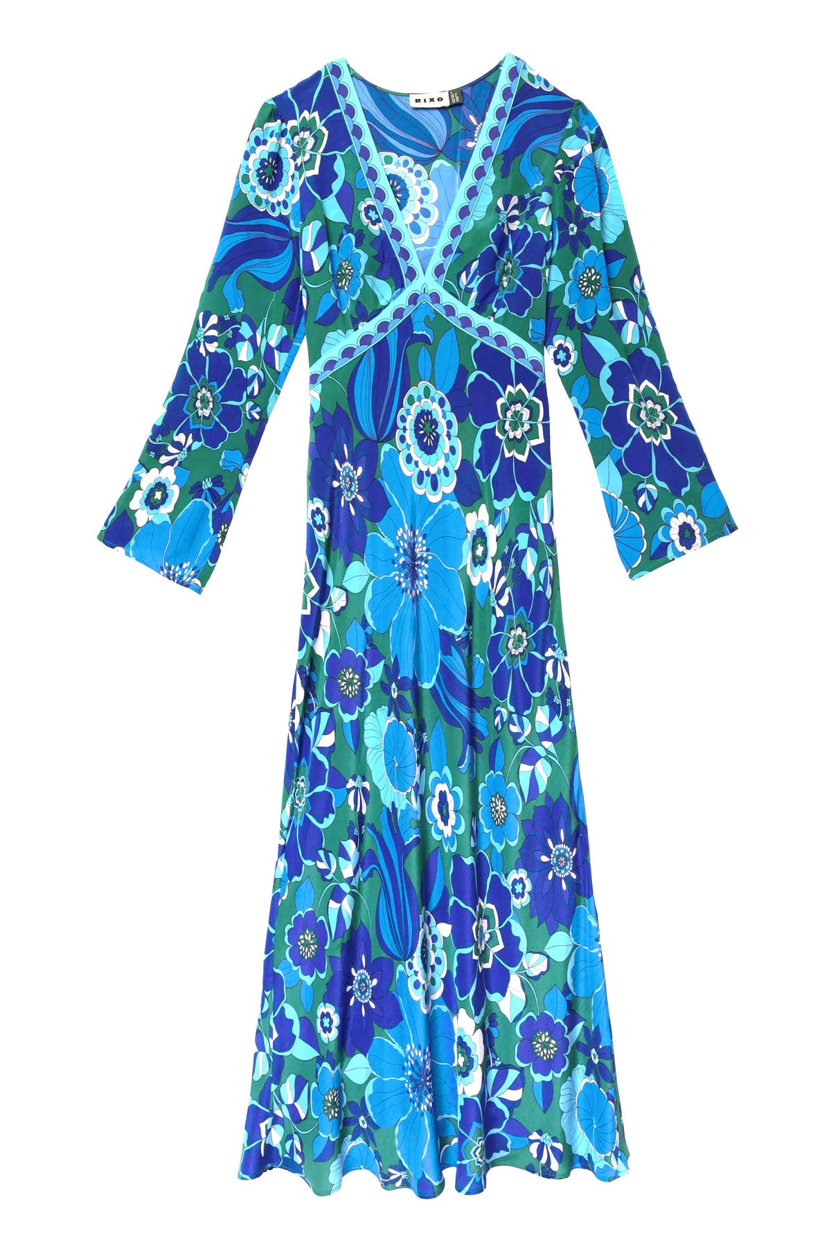 The tania - miami floral emerald dress is a knee-length, long-sleeve silk dress with a V-neckline and a bold blue, green, and white floral pattern.