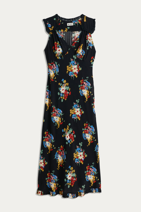 The Chessie - Darcie Floral Black is a sleeveless black midi dress featuring a colorful floral print, v-neckline, and ruffled details on the shoulders and hem, shown laid flat on a white background.