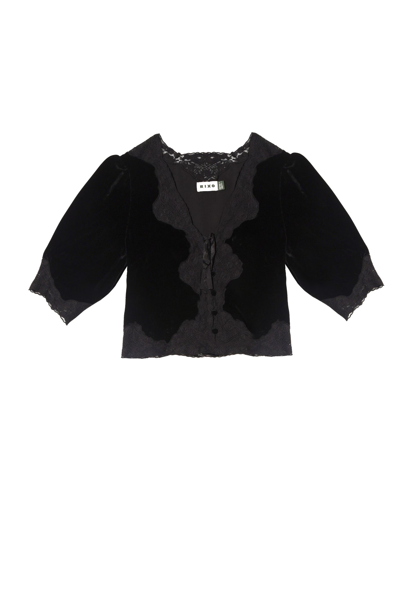 The Ursula - Black blouse features black velvet, three-quarter puff sleeves, lace trim on the neckline and cuffs, and a front tie closure. This elegant MIXO piece exudes vintage charm with its delicate details.