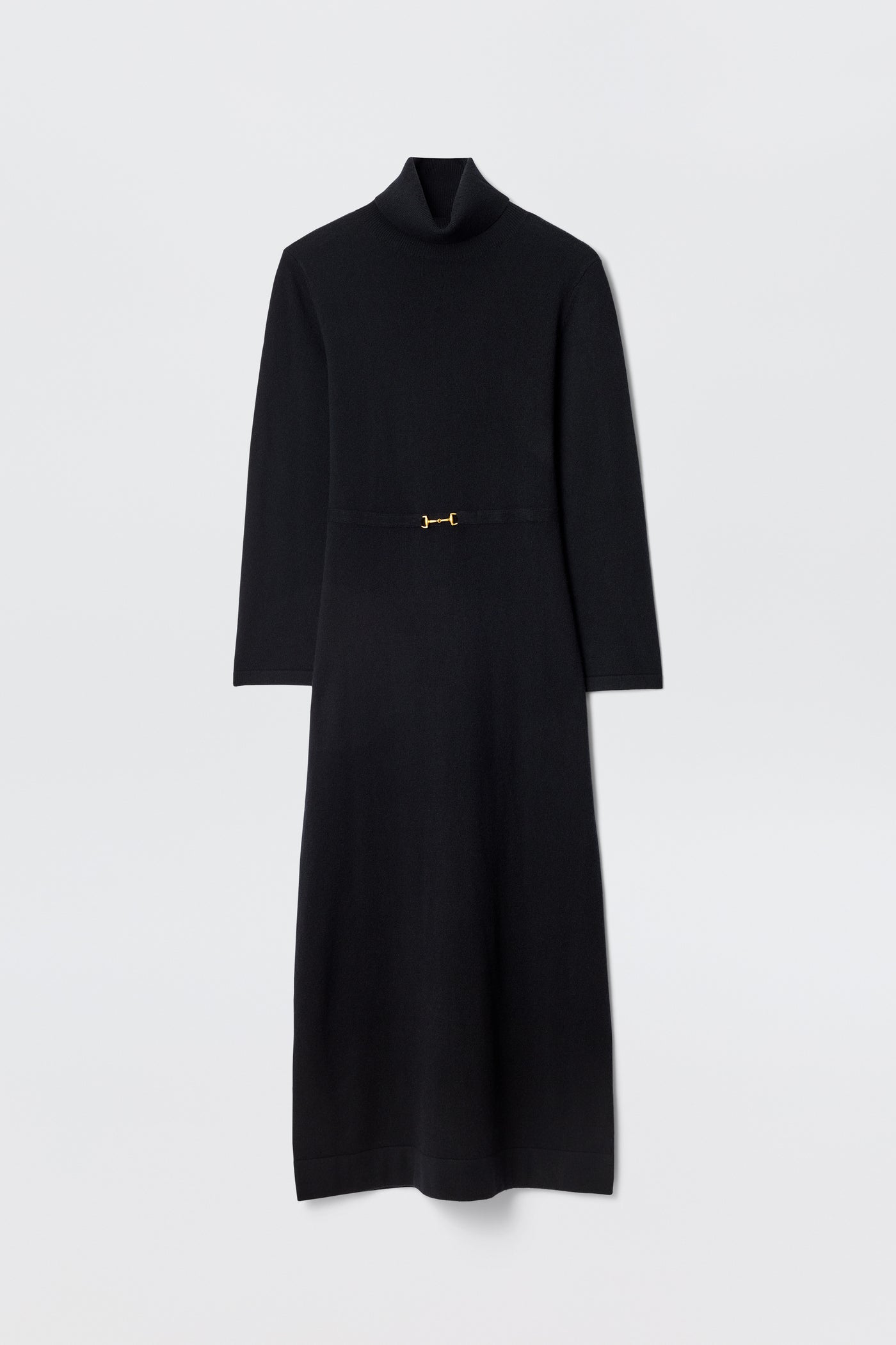 The Elliette - Black is a long-sleeved, minimalist black midi dress with a turtleneck, fitted waist, and a small gold clasp at the center, shown flat against a plain white background.