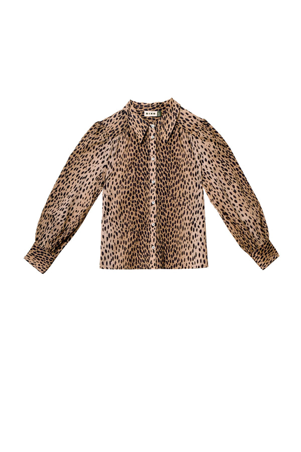 The Blake - Antelope Spot is a long-sleeved, button-up shirt in brown and black leopard print with a collar and slightly puffed sleeves, crafted from airy cotton-voile and shown on a white background.