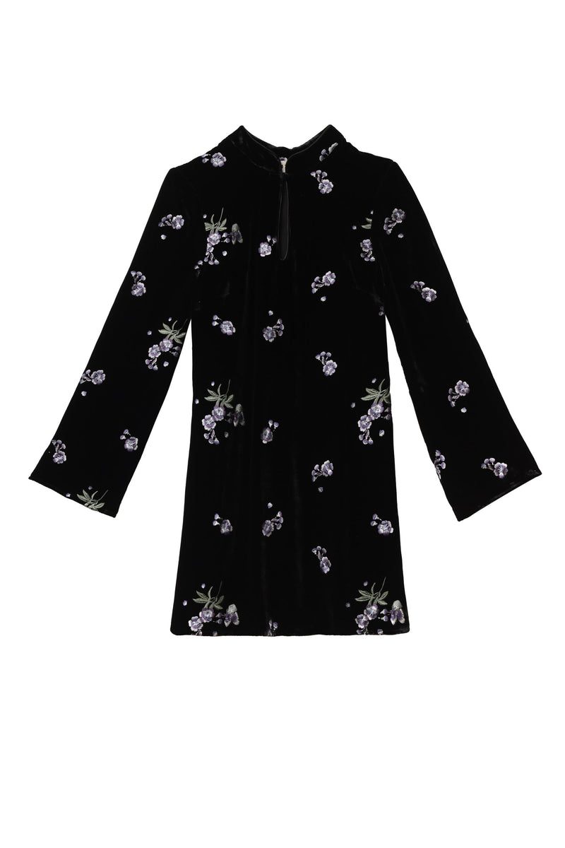 The Calla - Blossom Embroidery Blue is a long-sleeve velvet dress with a high neckline, straight silhouette, slightly flared sleeves, and features blue blossom embroidery details.
