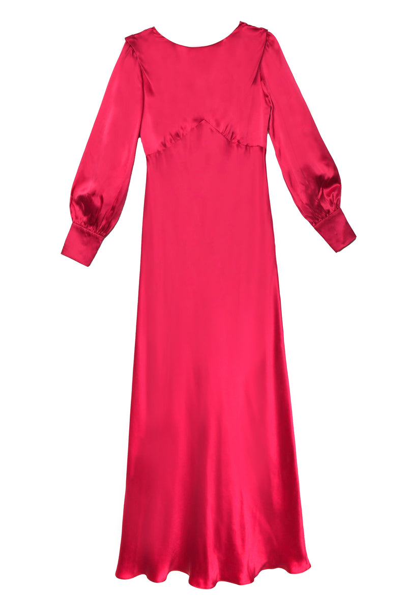 The marni - raspberry is a floor-length, long-sleeved gown in bright satin with a fitted bodice, puffed sleeves, and an empire waist seam for a vintage-inspired look.