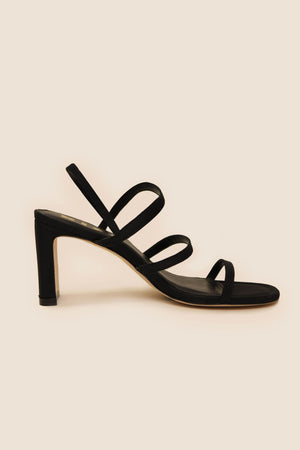 Ciervo - Black strappy leather sandals with three slim straps over the foot and an ankle strap, shown on a beige background—an ideal vintage-inspired accessory for RIXO occasion wear.