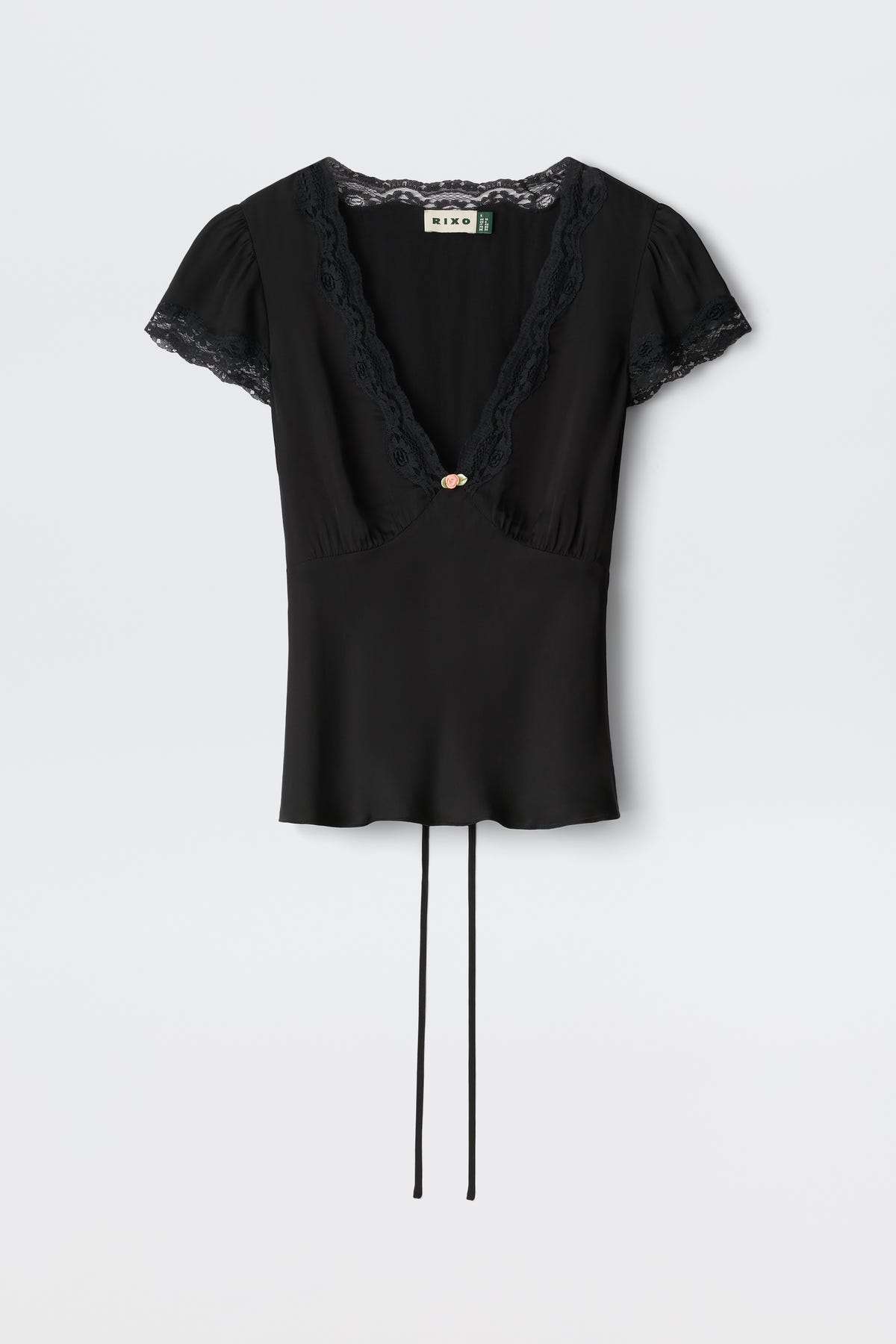 The Karia - Black blouse features short sleeves, lace trim on the V-neck and sleeves, a central decorative button, and two long waist ties.
