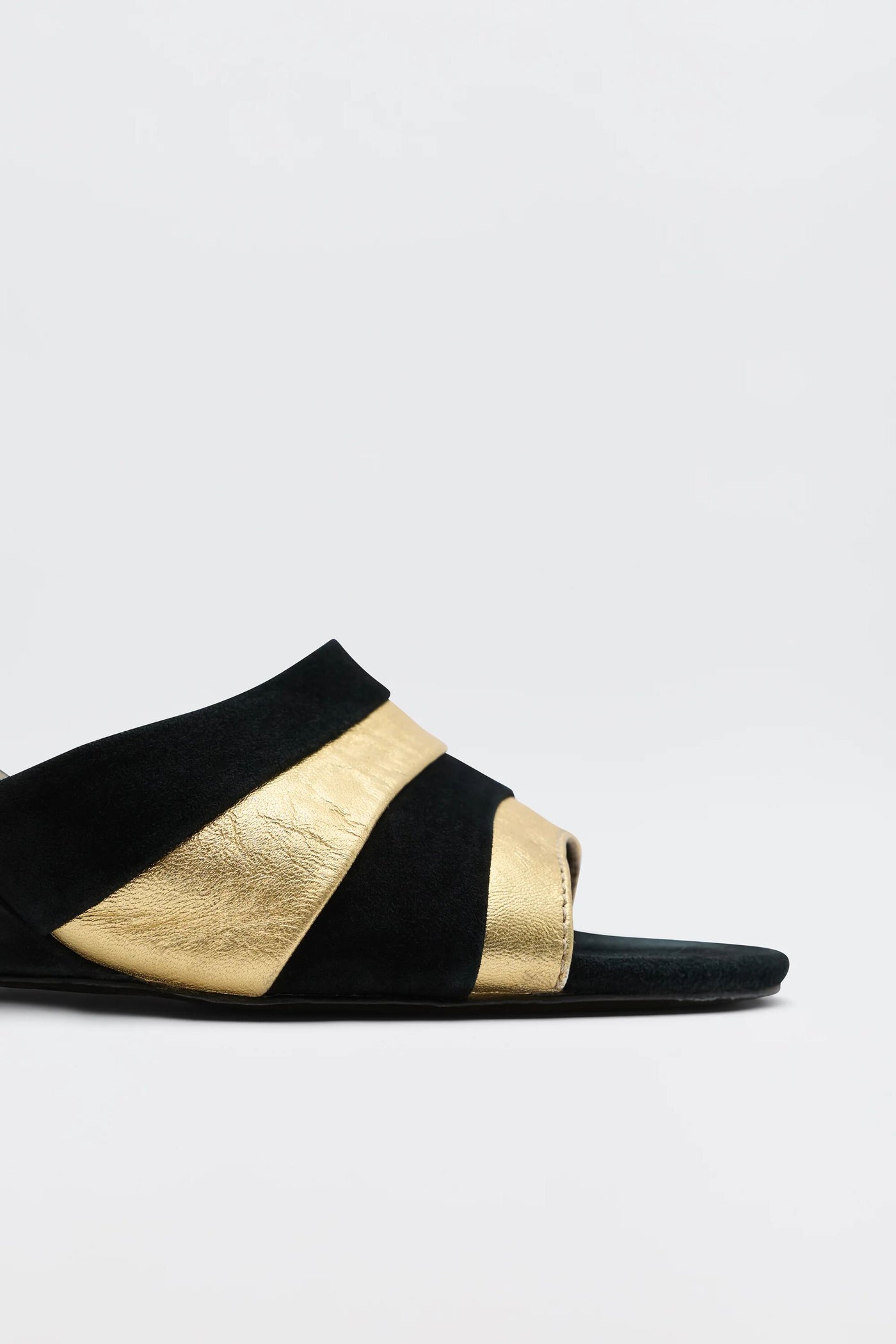 The Alira - Gold is a '70s-inspired wedge sandal featuring two wide metallic gold bands across the top against a plain white background.