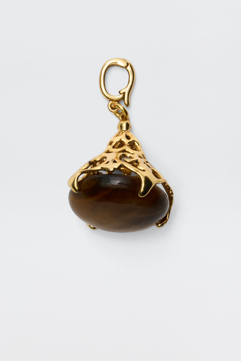 The Maella - Gold pendant features a brown oval tiger's eye stone set in an ornate 18K gold-plated setting with a top loop for necklace attachment, shown against a plain white background.