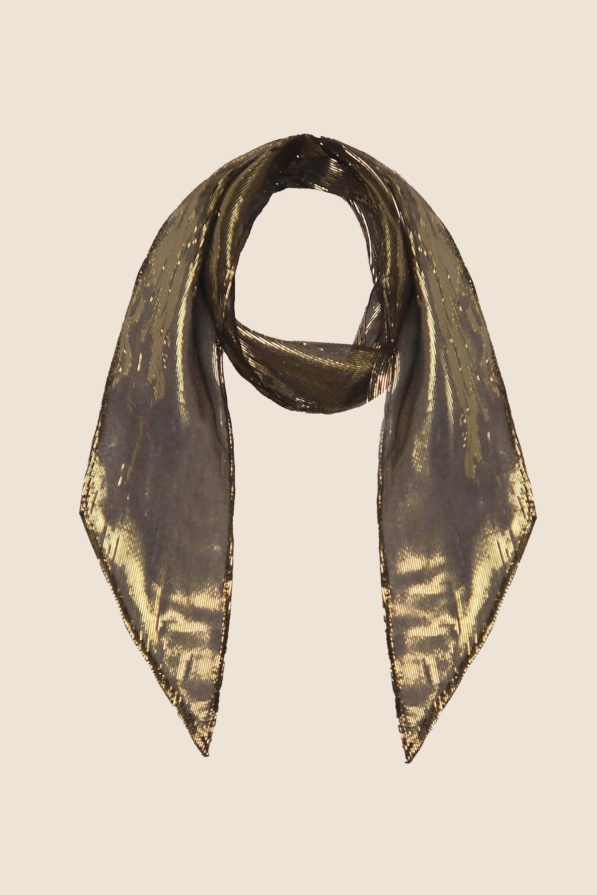 The Alexa - Gold scarf, featuring a sheer fabric with a subtle metallic sheen, is laid flat with pointed ends down and the center looped in a circle on a plain light background.
