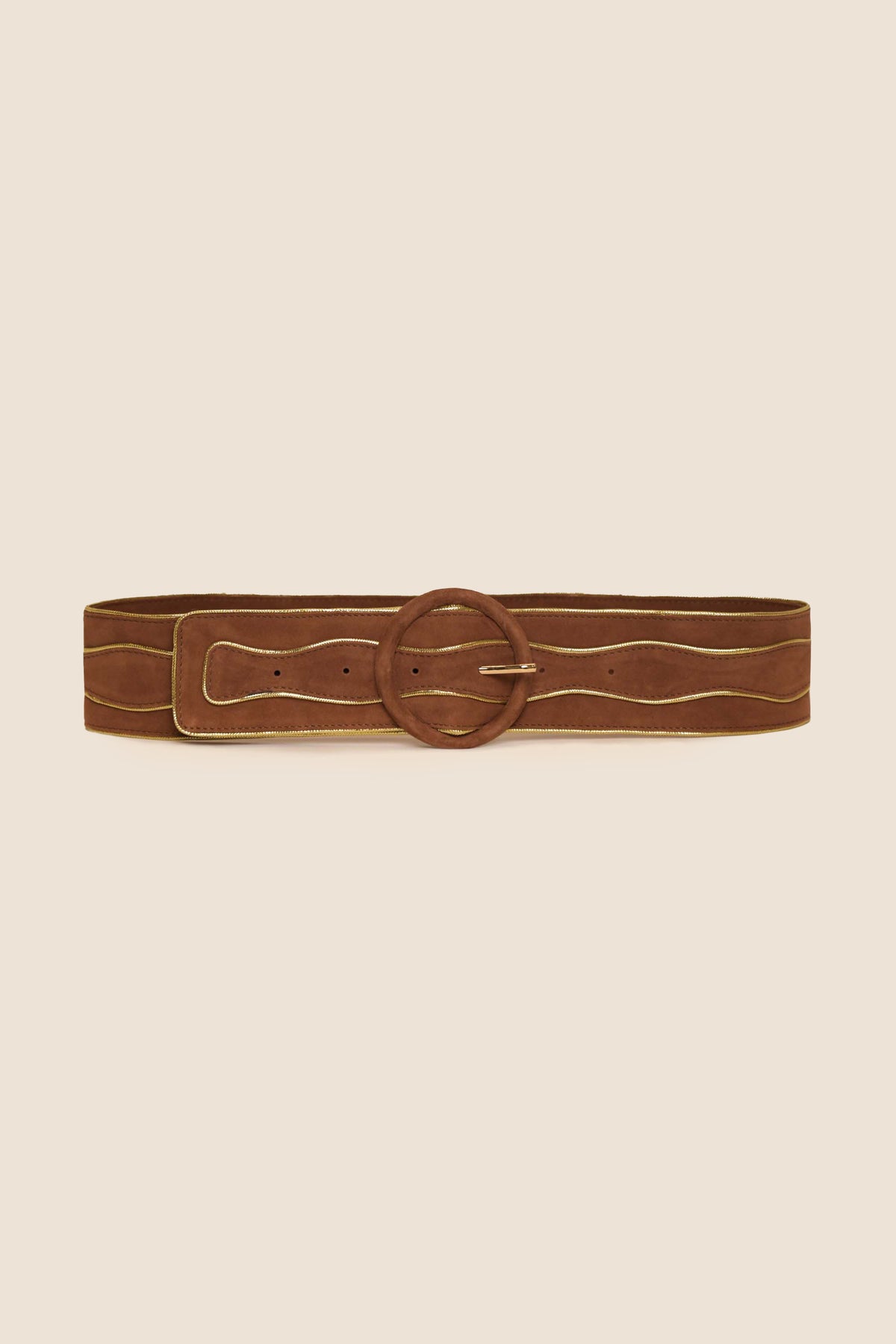 The Catalina - Tan is a wide brown suede belt featuring a large round buckle and light-colored stitching, shown against a plain beige background.
