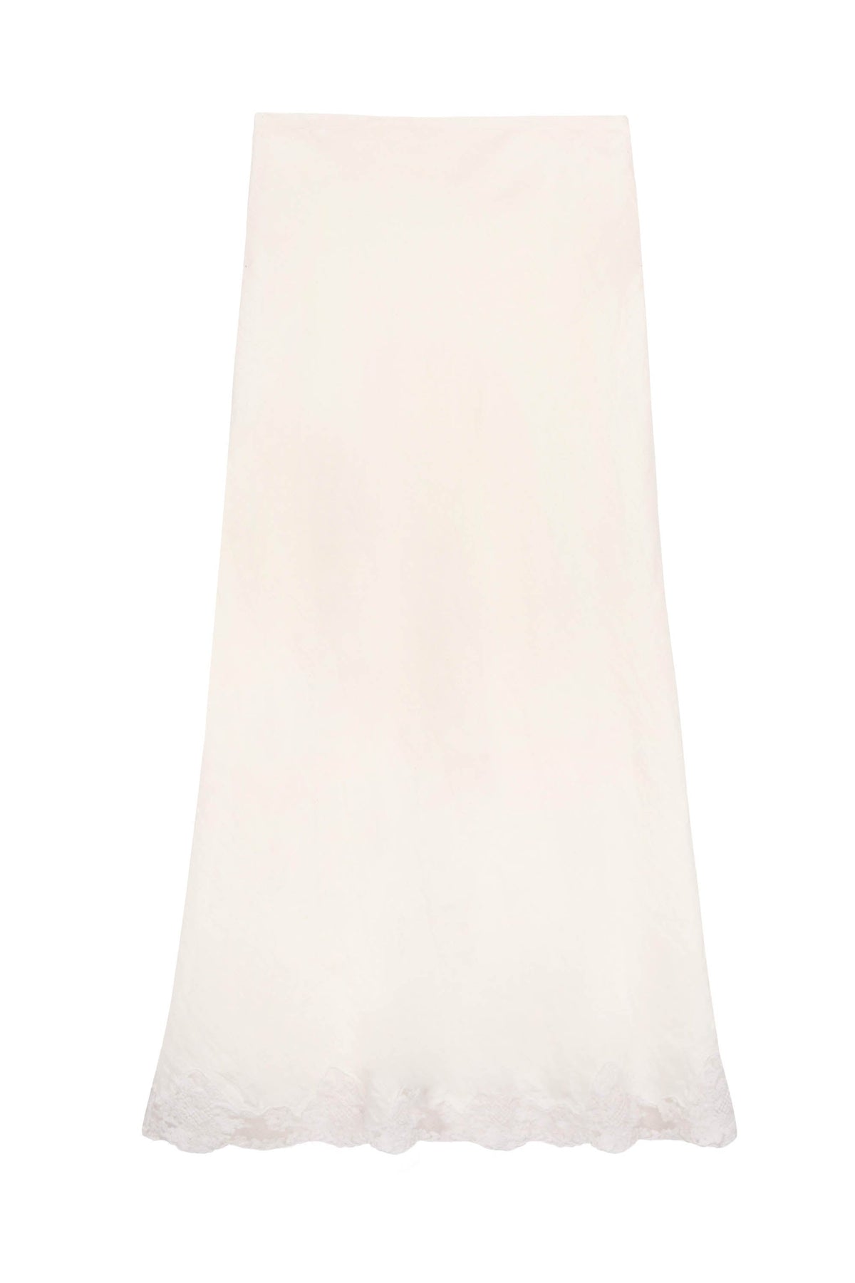 The Crystal - Cream is a long, cream midi slip skirt with a subtle floral pattern and delicate lace trim along the scalloped hem, shown against a plain white background.