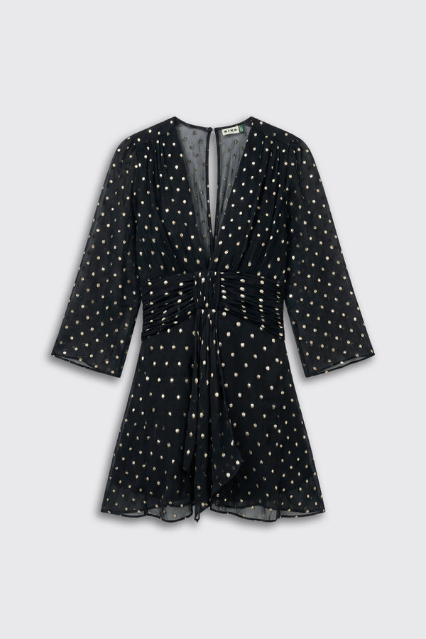 Clove - Gold Spot Black mini dress with three-quarter sleeves, a deep V-neck, and a gathered waist, featuring an all-over gold polka dot pattern.