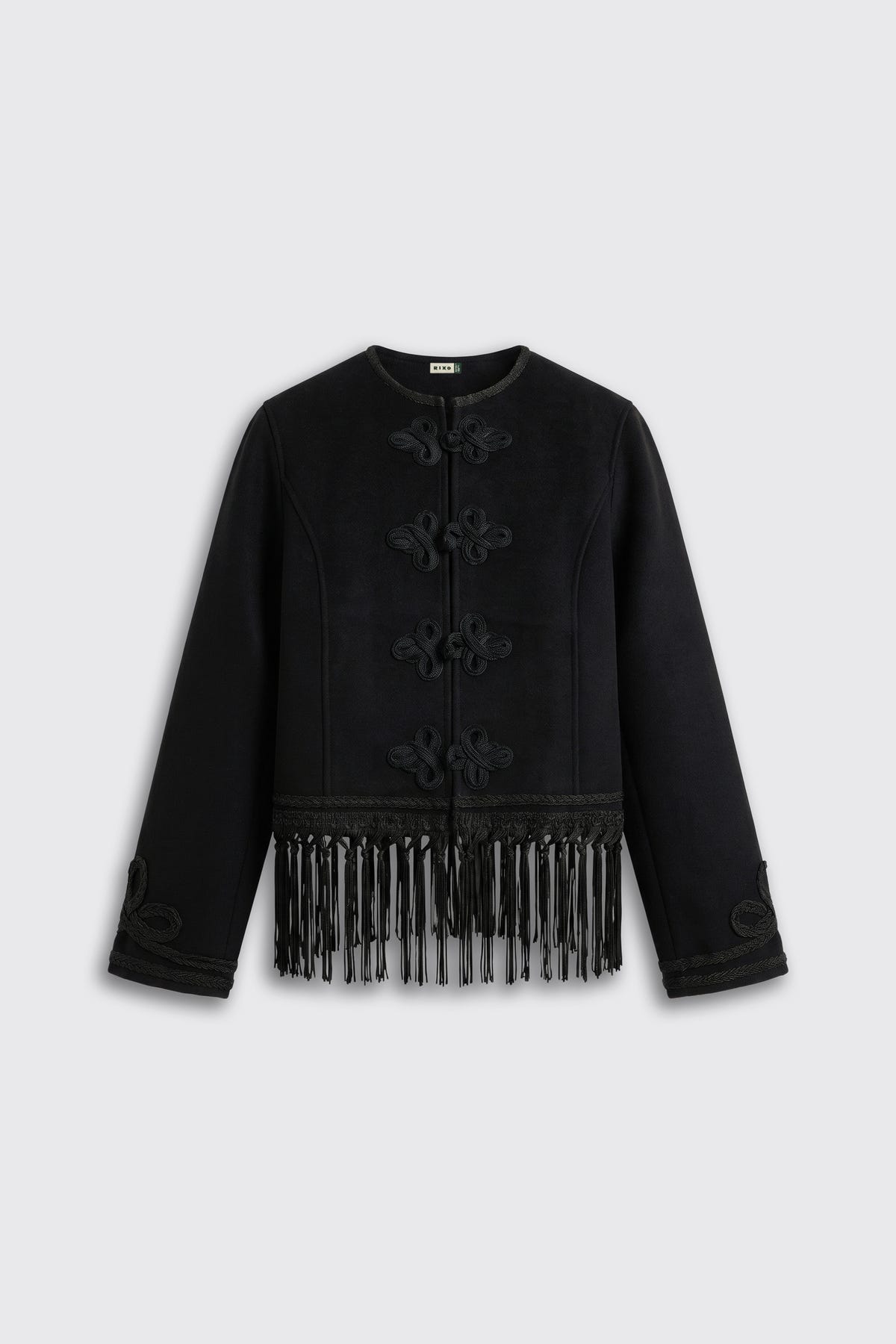 Inga - Black: A long-sleeve black jacket featuring decorative knots on the front and fringe detailing along the bottom hem, displayed against a light grey background.