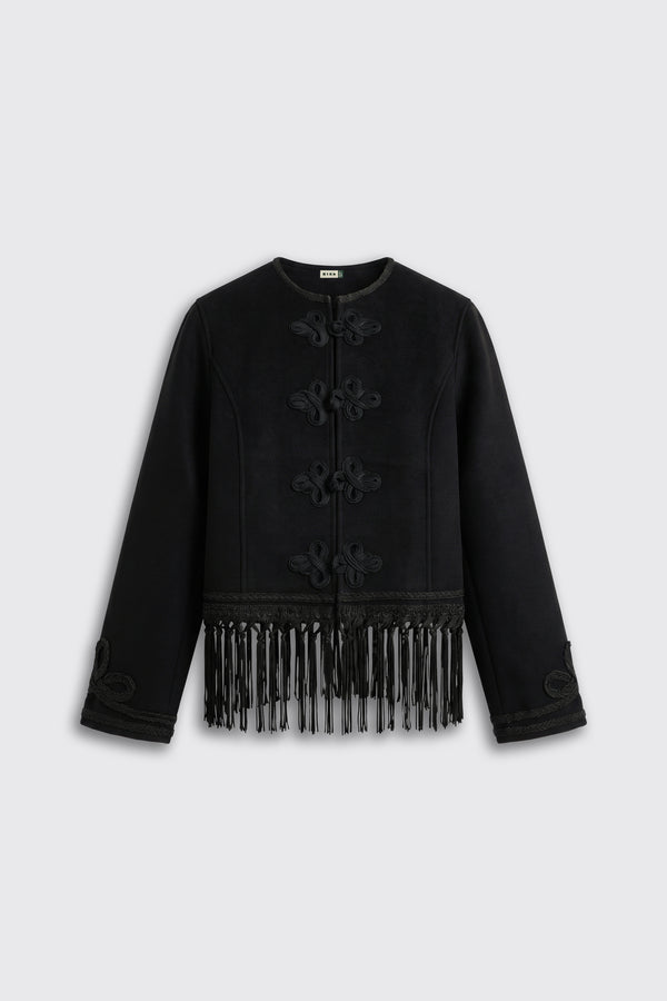 Inga - Black: A long-sleeve black jacket featuring decorative knots on the front and fringe detailing along the bottom hem, displayed against a light grey background.