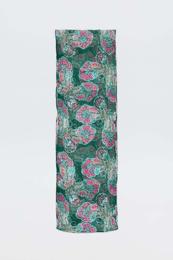 A rectangular piece of fabric, Julien - Butterfly Bloom Green, featuring a vibrant butterfly bloom pattern in green, pink, and teal stands upright against a plain white background.