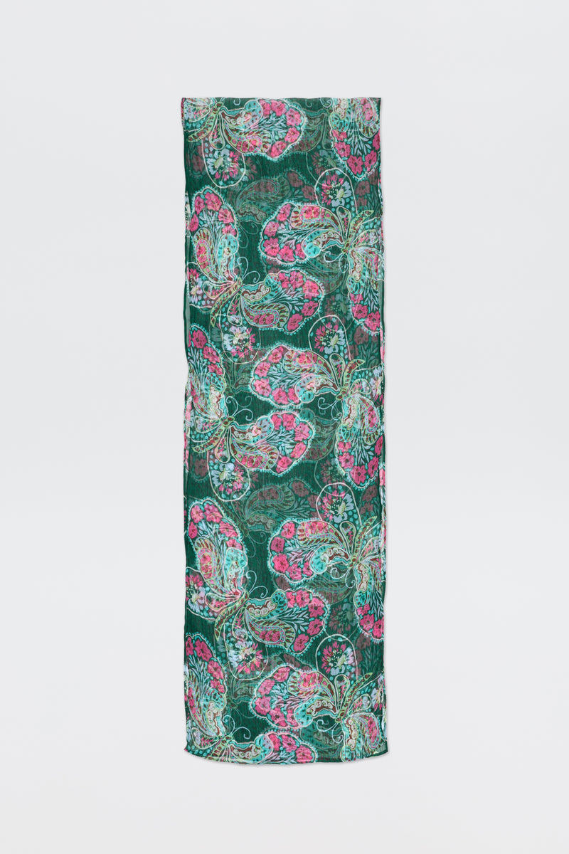 A rectangular piece of fabric, Julien - Butterfly Bloom Green, featuring a vibrant butterfly bloom pattern in green, pink, and teal stands upright against a plain white background.