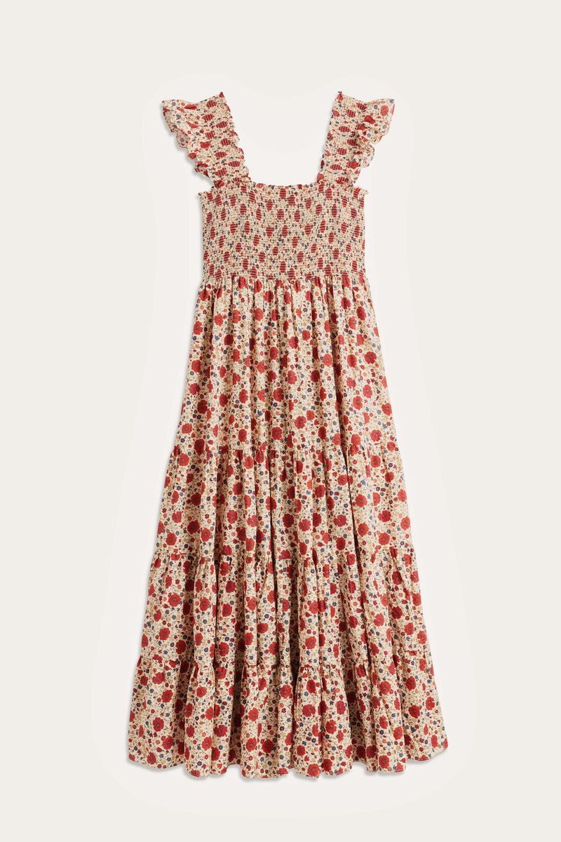 The Kendall - Eva Floral Cream is a sleeveless, ankle-length cotton-voile dress with a smocked bodice, ruffled straps, and red and pink floral print on cream. Features a tiered skirt for a breezy bohemian look.