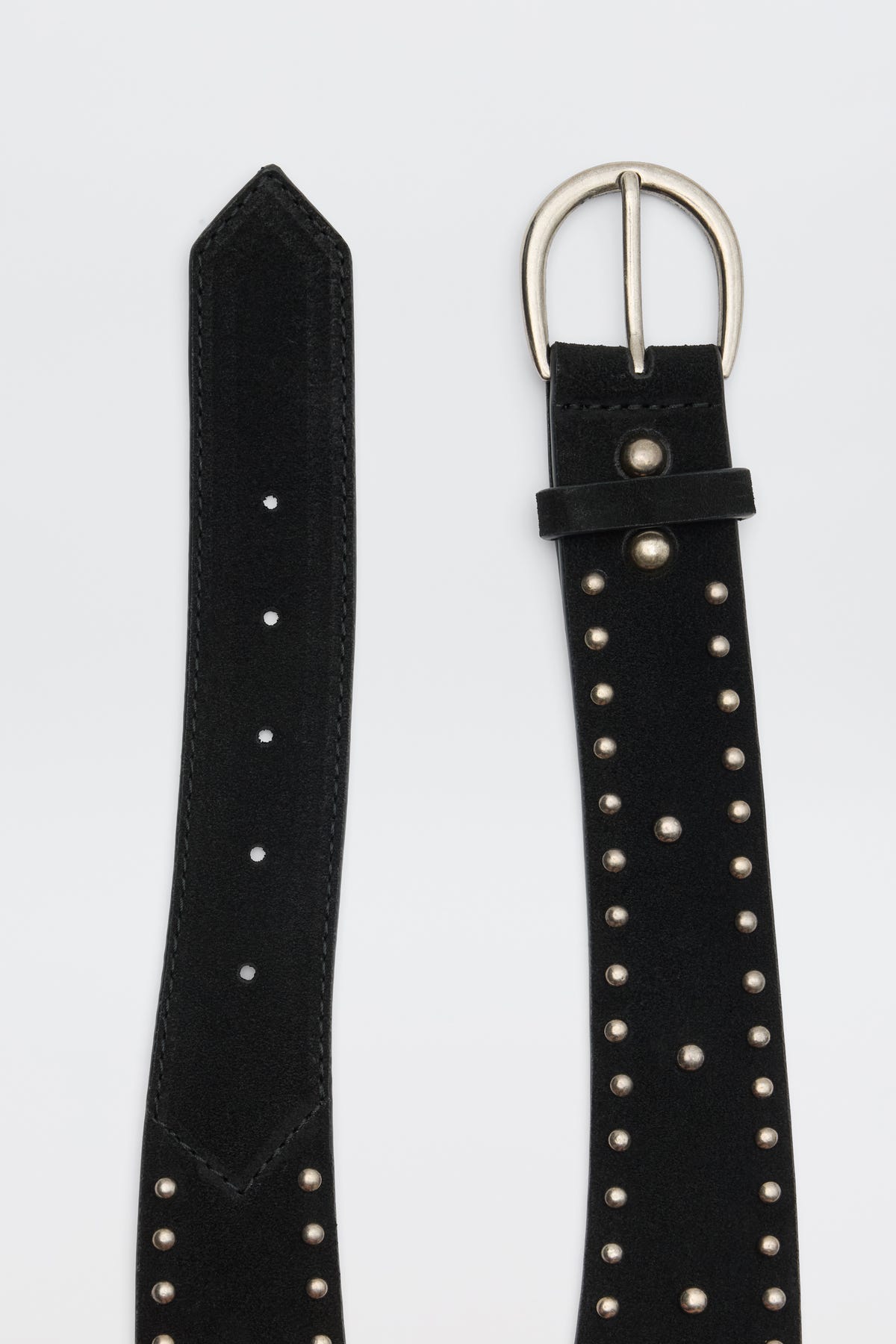Lorelei - Black suede belt featuring silver studs, multiple holes, and a silver buckle, shown with both the buckle end and pointed tip visible against a plain background.