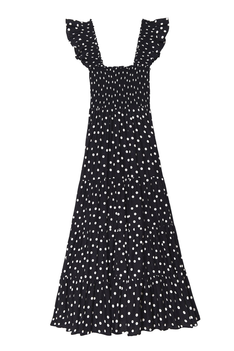 The Kendall - Bohemia Spot Deep Navy is a black, ankle-length cotton-voile dress with white polka dots, ruffled cap sleeves, a square neckline, and a tiered flowy skirt—ideal for breezy-dress lovers.