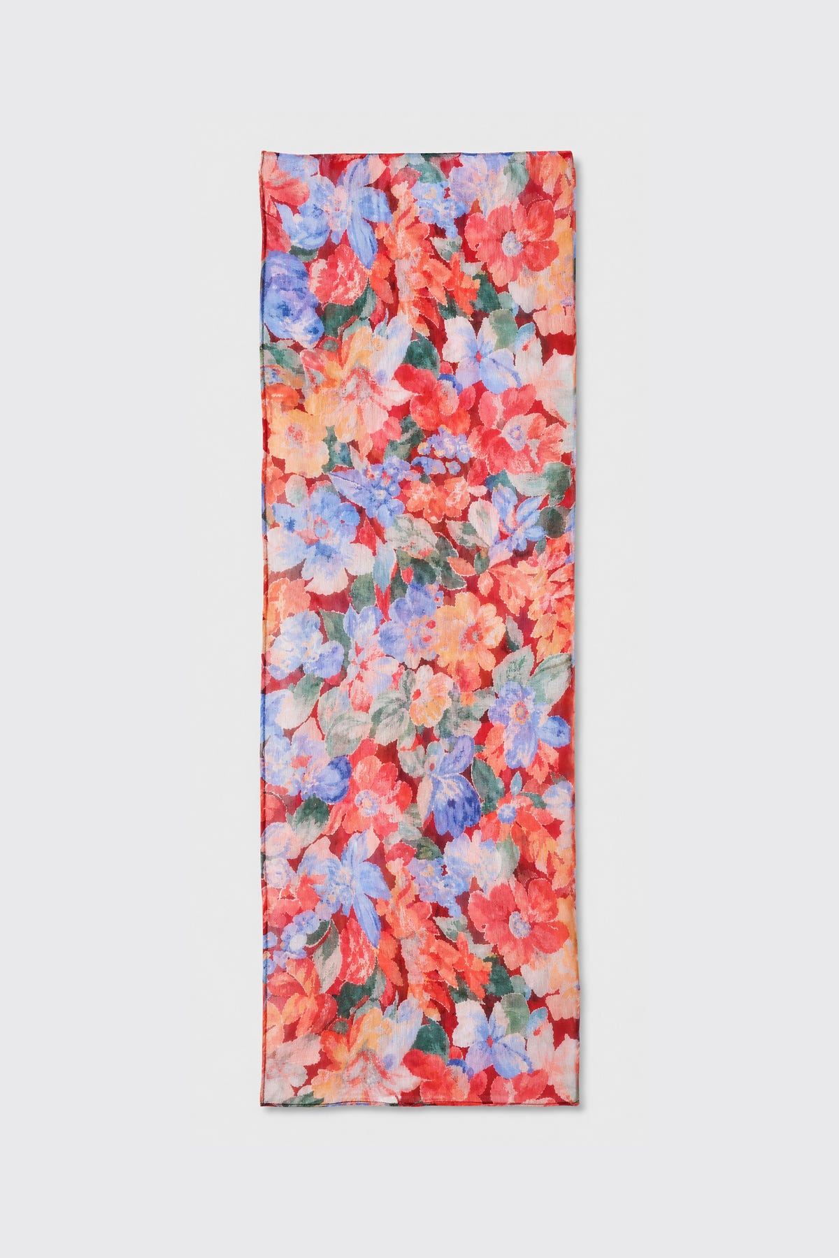 A rectangular scarf named “Julien - Chelsea Floral Red,” featuring a vibrant floral pattern in red, blue, pink, and green hues, is displayed flat on a light gray background.