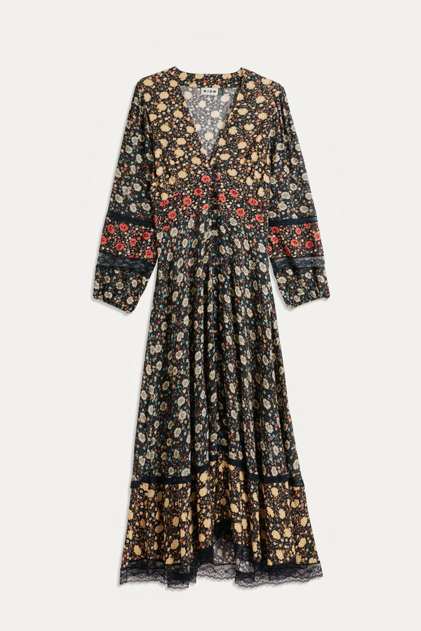 The Raven - Eva Floral Mix Black is a RIXO signature V-neck maxi dress with long sleeves, featuring a yellow, red, and white floral print on black and delicate lace trim at the hem and cuffs.
