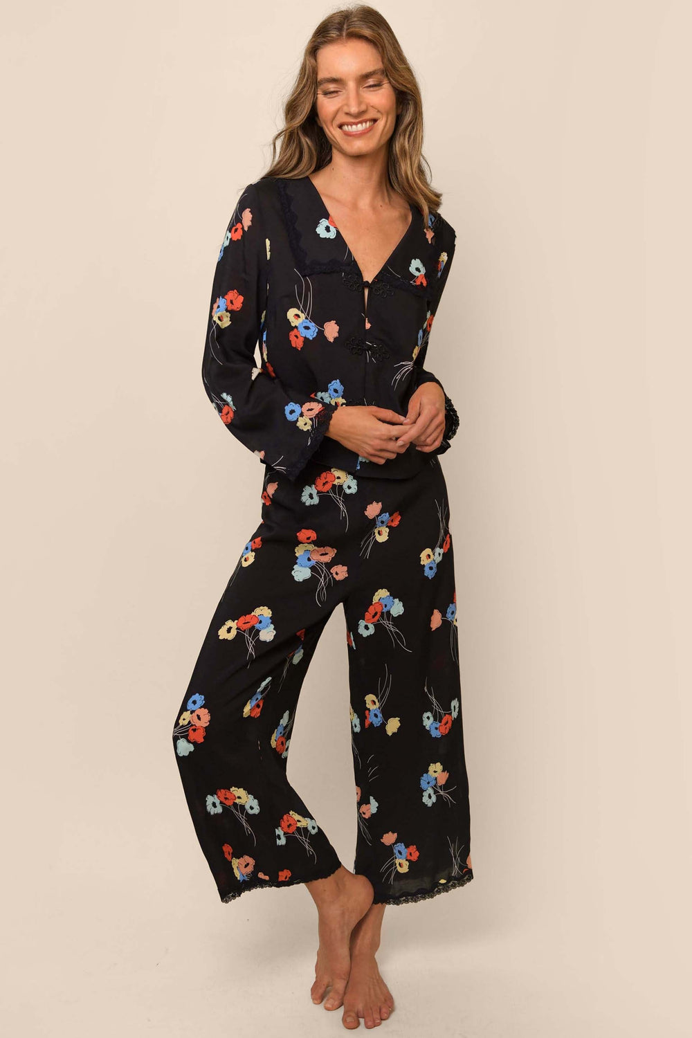 The Rixo Annabelle pyjamas' hand-painted carnations make us look forward to bedtime, and her statement collar and smart cut make her delectable loungewear any day.