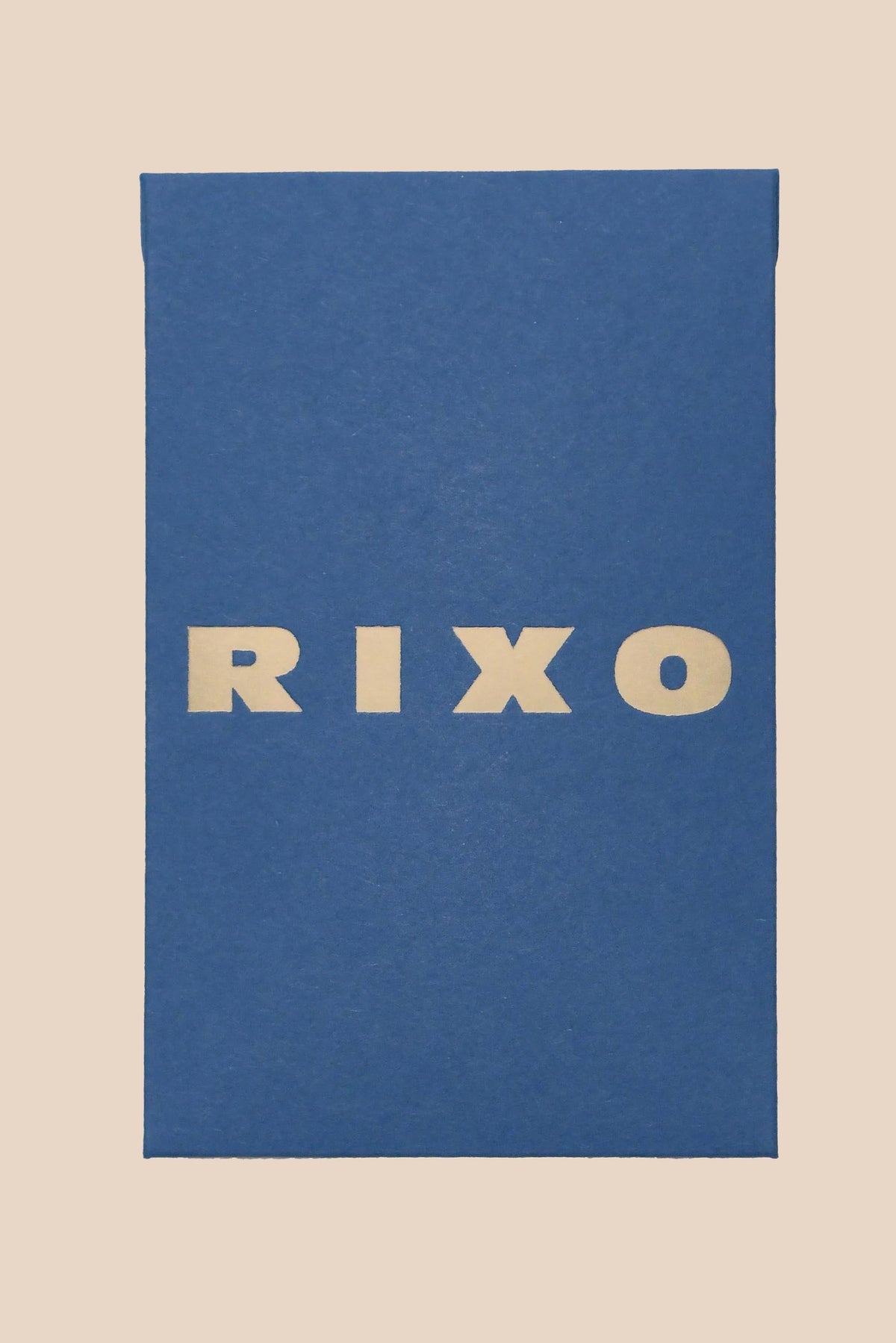 A rectangular blue box with bold, cream "RIXO" lettering at the center on a light beige background—perfect for gifting or celebrating vintage-inspired style with an exclusive RIXO Gift Card.